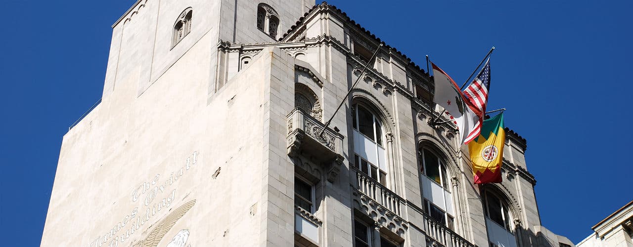 Neatly stacked gold bars, representing wealth and assets.